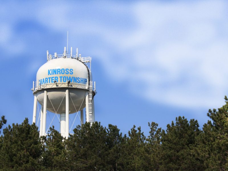 Kinross Township water tower view above treetops in forest below